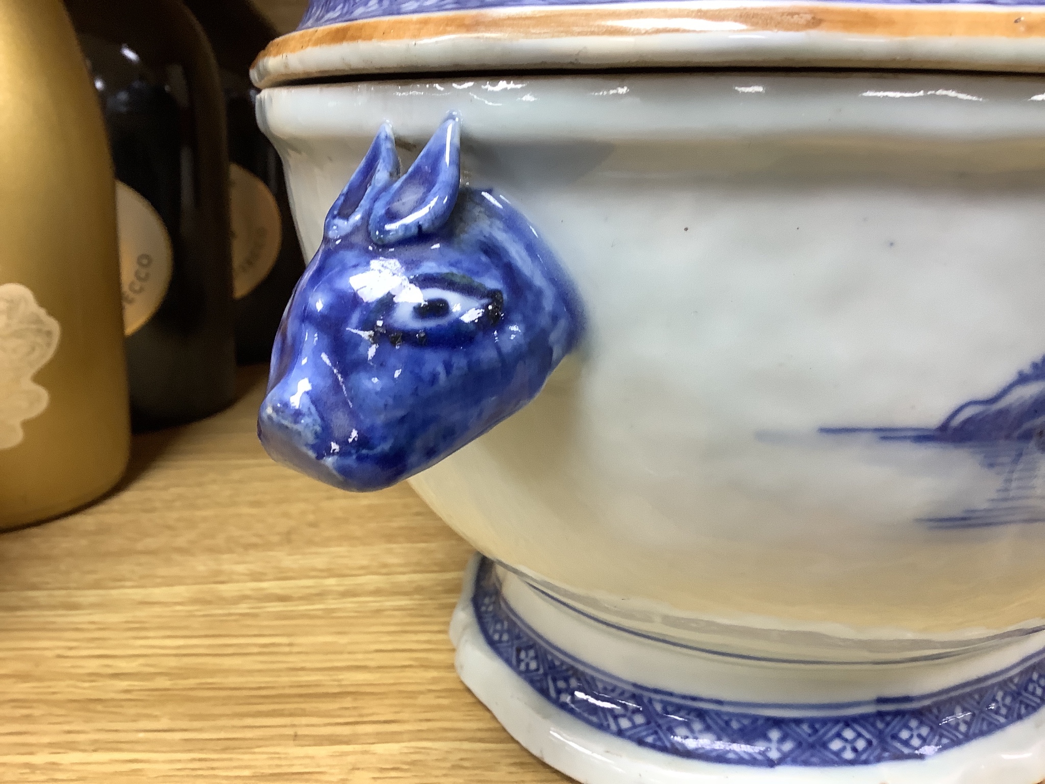 A 18th century Chinese export blue and white tureen and cover pomegranate finial, length 35cm